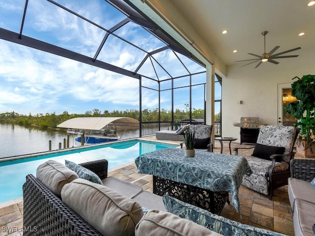 view of swimming pool featuring an outdoor living space, a water view, ceiling fan, a lanai, and a patio