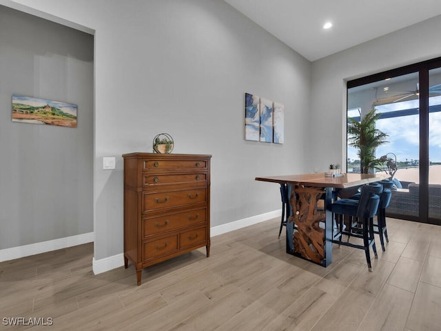 dining space with light hardwood / wood-style floors