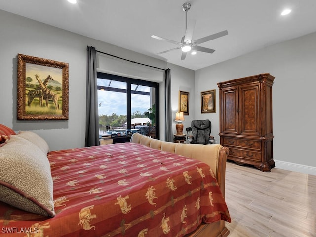 bedroom featuring access to outside, ceiling fan, and light hardwood / wood-style floors