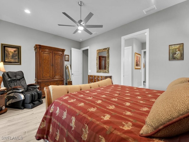 bedroom with ceiling fan and light wood-type flooring