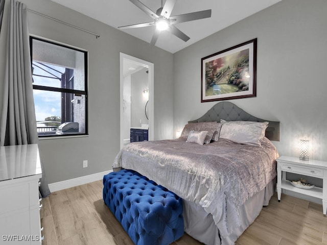 bedroom with ensuite bathroom, ceiling fan, and light hardwood / wood-style flooring