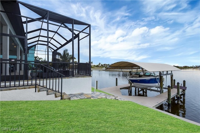 dock area featuring a yard, a water view, and glass enclosure