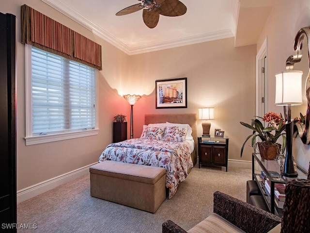 bedroom featuring ceiling fan, crown molding, and light carpet