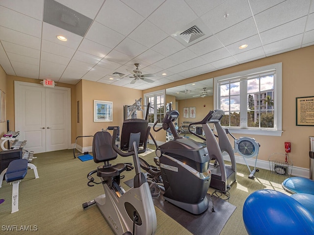 workout area with a drop ceiling and ceiling fan