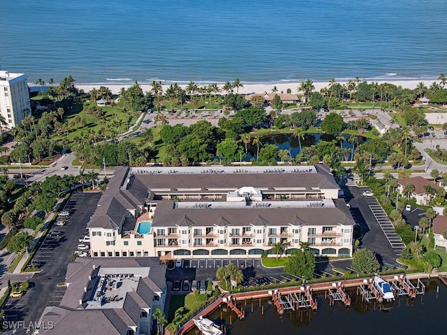 aerial view with a water view and a view of the beach