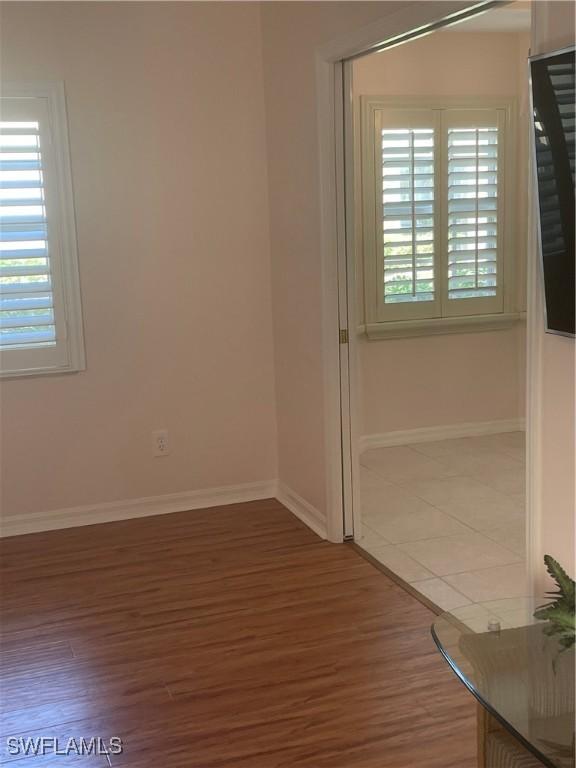 spare room with dark hardwood / wood-style flooring