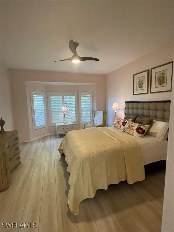 bedroom featuring ceiling fan and light hardwood / wood-style floors