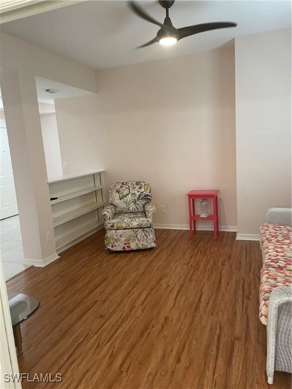 unfurnished room featuring ceiling fan and wood-type flooring