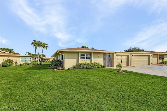 ranch-style home with a garage and a front lawn