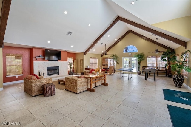 tiled living room featuring beamed ceiling and high vaulted ceiling