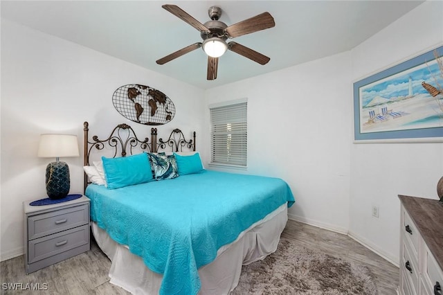 bedroom featuring ceiling fan and light hardwood / wood-style flooring