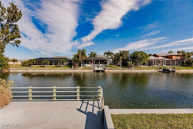 view of dock with a water view and a residential view