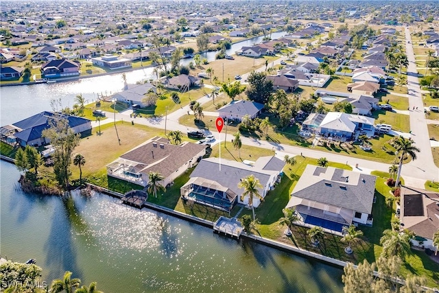 bird's eye view with a water view and a residential view