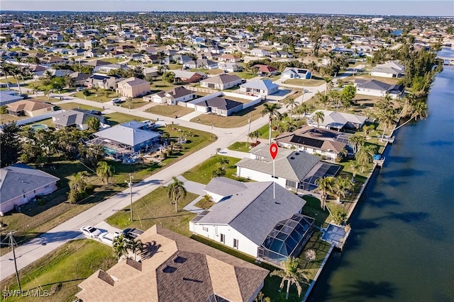 aerial view featuring a residential view and a water view