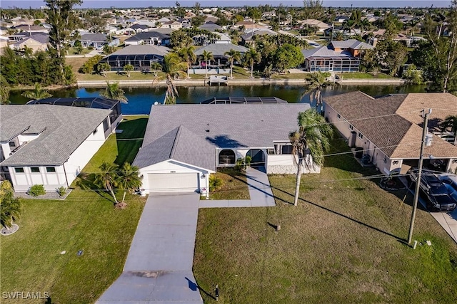 aerial view with a water view and a residential view