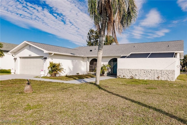 ranch-style house with a garage, a front yard, concrete driveway, and stucco siding