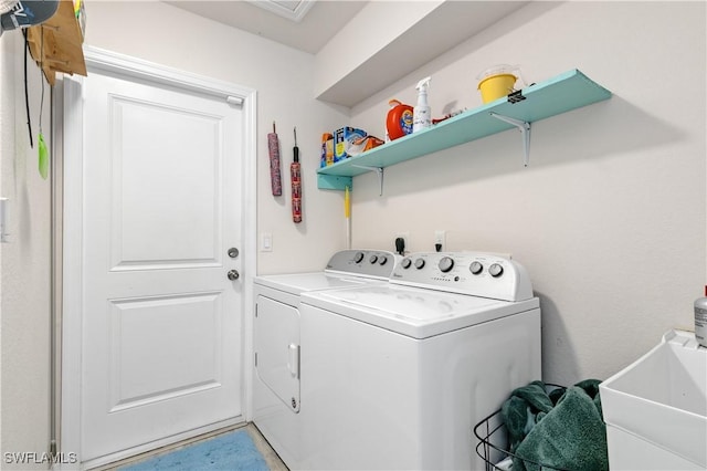 laundry area featuring separate washer and dryer and sink