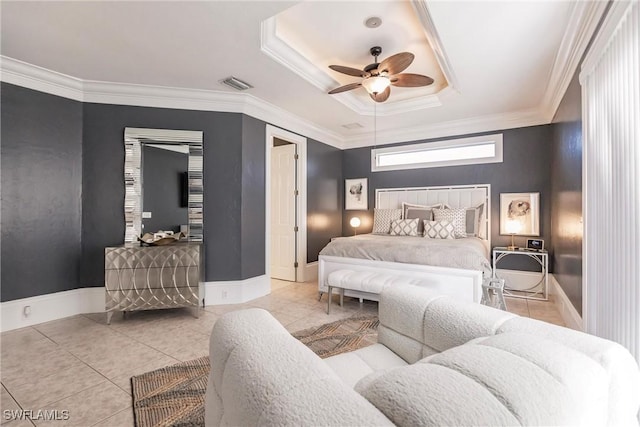 tiled bedroom featuring a tray ceiling, ceiling fan, and ornamental molding