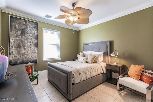 bedroom featuring ceiling fan, light tile patterned floors, and ornamental molding