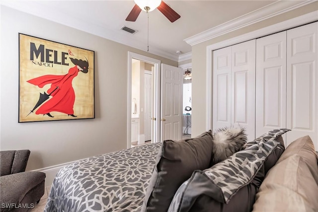 bedroom with a closet, ceiling fan, and crown molding