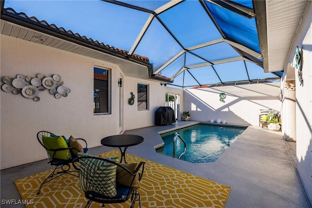 view of swimming pool with a lanai, area for grilling, and a patio