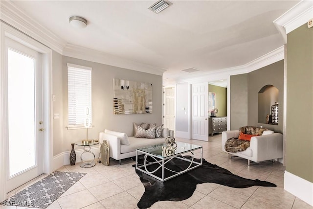 living room featuring light tile patterned floors and ornamental molding