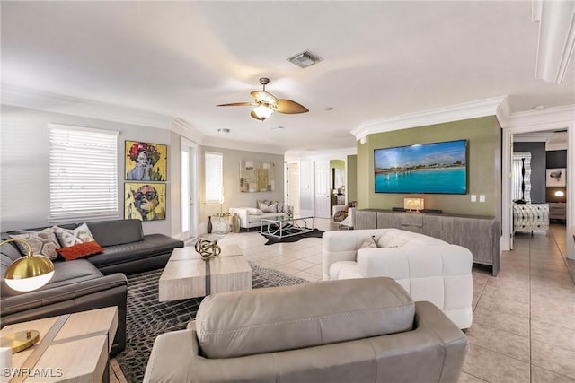 living room with ceiling fan, light tile patterned flooring, and ornamental molding