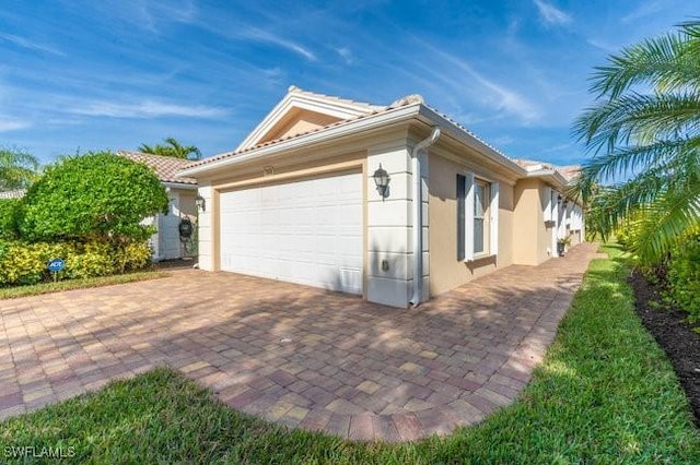 view of side of property with a garage