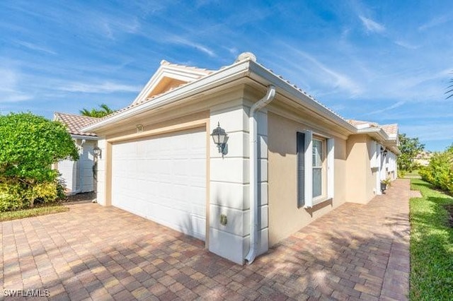 view of property exterior with a garage