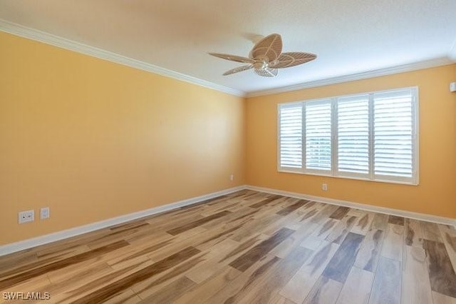 spare room with light wood-type flooring, ceiling fan, and crown molding