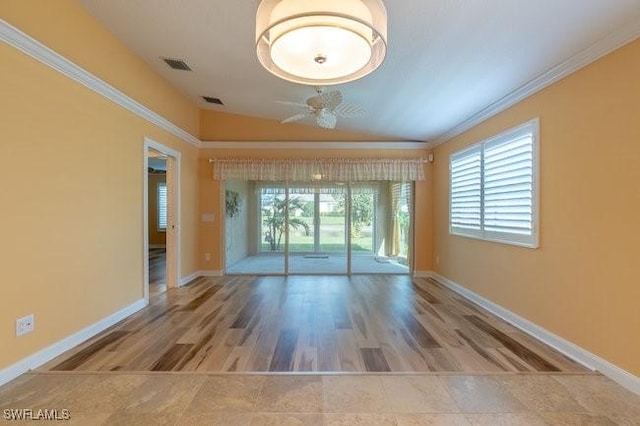 empty room with ceiling fan, a healthy amount of sunlight, and ornamental molding