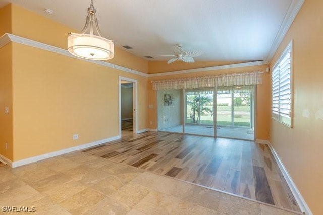 unfurnished room with crown molding, ceiling fan, and hardwood / wood-style flooring