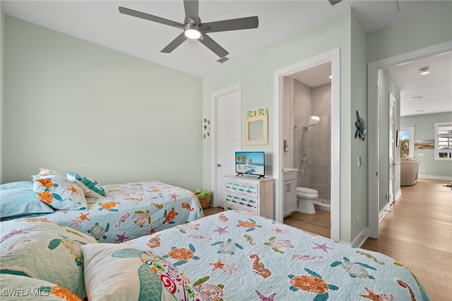 730 Matanzas Ct, Fort Myers Beach, FL 33931 - bedroom with ceiling fan, connected bathroom, visible vents, wood finished floors, and baseboards