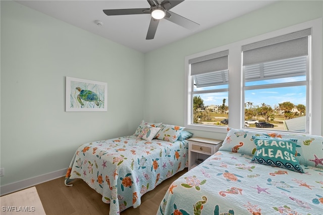 730 Matanzas Ct, Fort Myers Beach, FL 33931 - bedroom featuring wood finished floors, ceiling fan, and baseboards