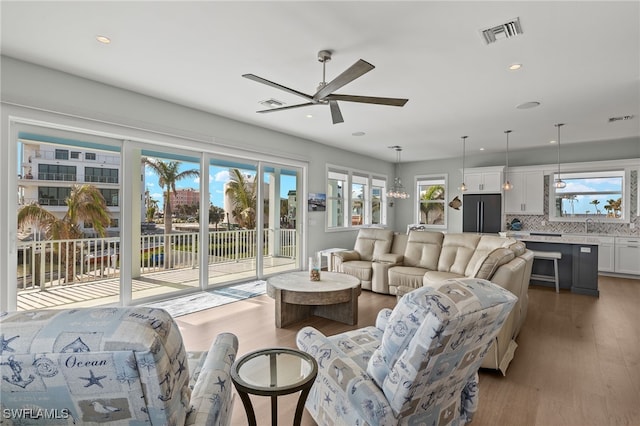 730 Matanzas Ct, Fort Myers Beach, FL 33931 - living area with wood finished floors, a ceiling fan, visible vents, and recessed lighting