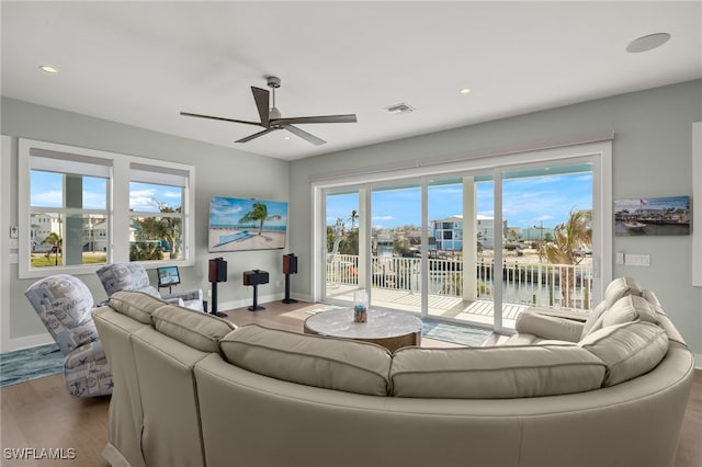 730 Matanzas Ct, Fort Myers Beach, FL 33931 - living area with visible vents, baseboards, a ceiling fan, and wood finished floors