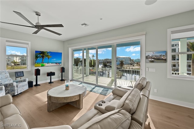 730 Matanzas Ct, Fort Myers Beach, FL 33931 - living area with visible vents, baseboards, a ceiling fan, and wood finished floors