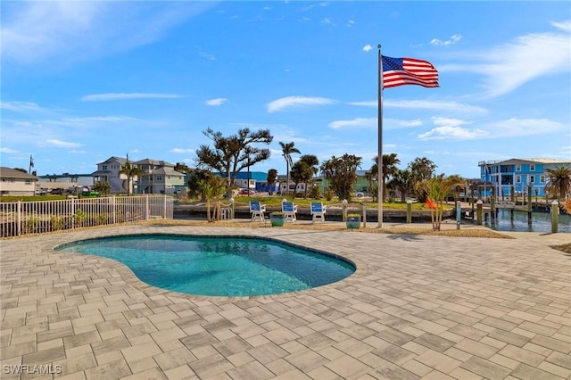 view of pool featuring a fenced in pool, a patio area, and fence