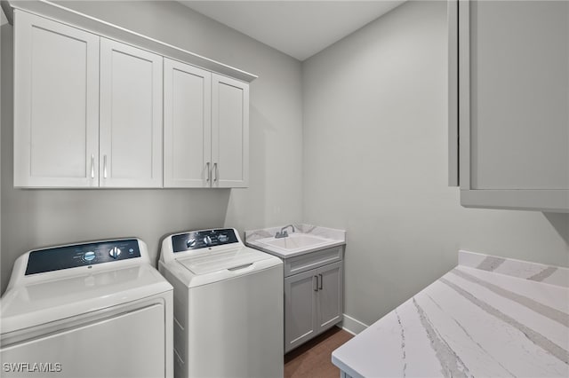 730 Matanzas Ct, Fort Myers Beach, FL 33931 - clothes washing area with washer and dryer, baseboards, a sink, and cabinet space
