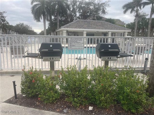 view of swimming pool featuring area for grilling