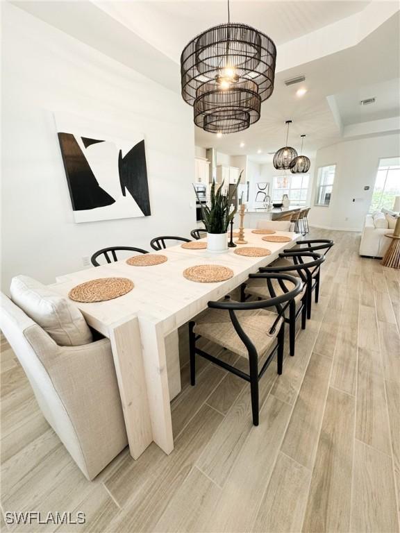 dining space with a notable chandelier