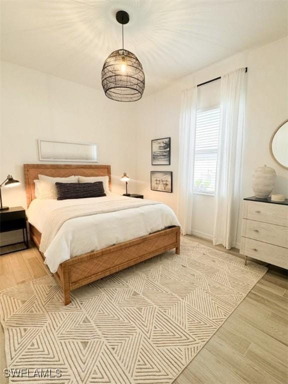 bedroom with light hardwood / wood-style floors