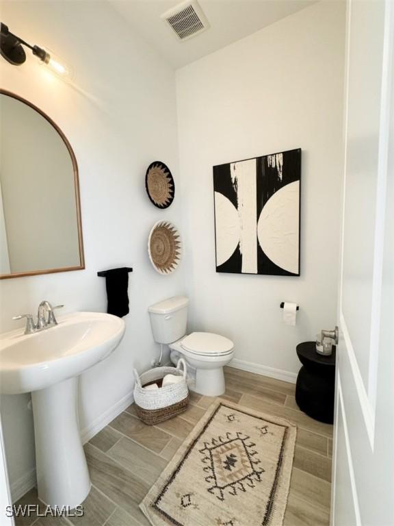 bathroom with sink and toilet