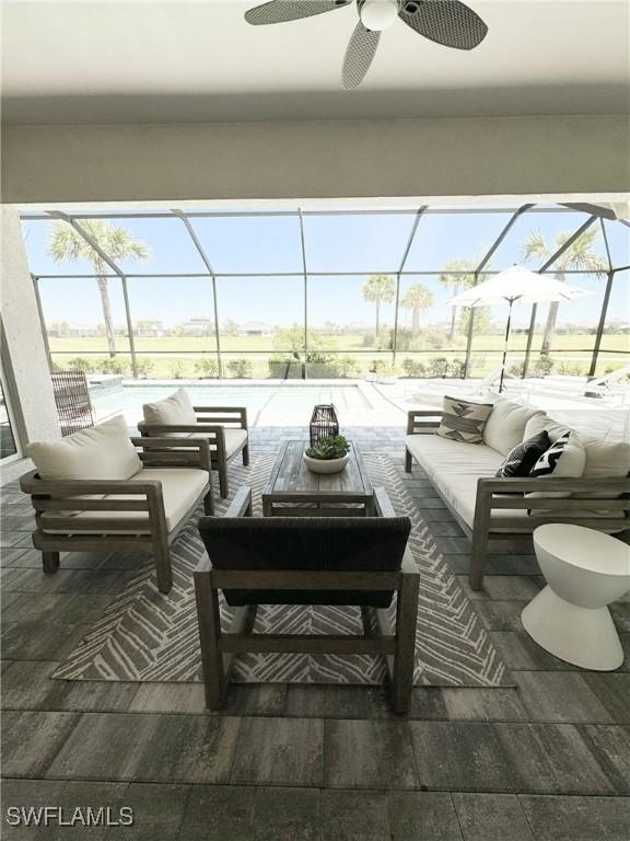 view of patio with an outdoor hangout area, ceiling fan, and a lanai