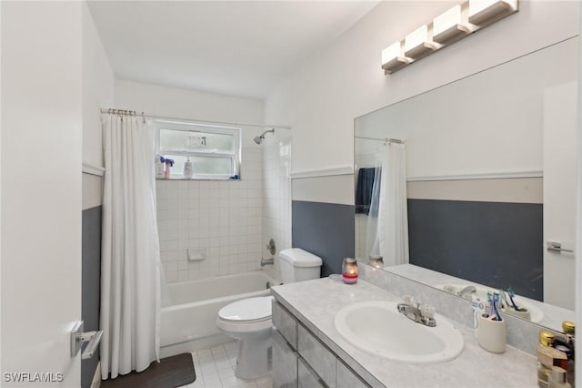 full bathroom featuring shower / bath combo, toilet, and vanity