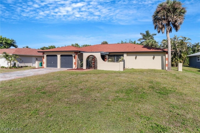 ranch-style house with a garage and a front lawn