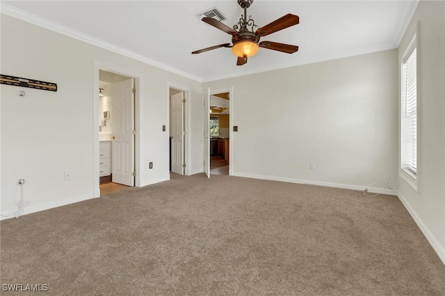 unfurnished bedroom featuring connected bathroom, ceiling fan, crown molding, and light colored carpet