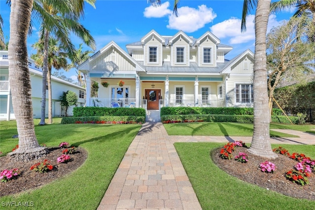 view of front facade with a front lawn and a porch