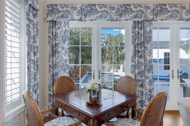 dining space featuring french doors and hardwood / wood-style floors