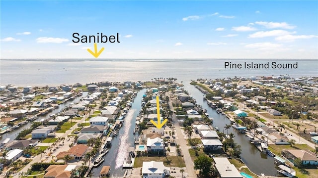 birds eye view of property featuring a water view